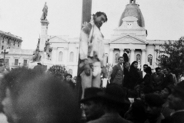 Villaroel hanging from a lamp post